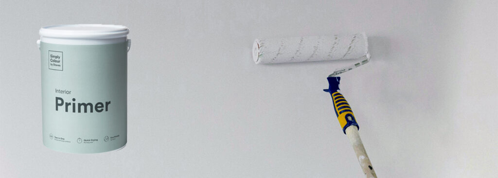 Simply Colour Interior Primer tin with a paint roller applying white primer on a wall.